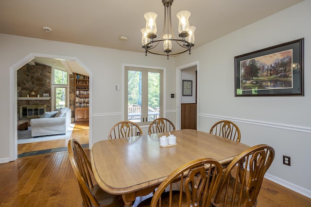 301 Atwood Dr, Lexington, KY 40515 - dining space featuring hardwood / wood-style floors, a chandelier, and a fireplace