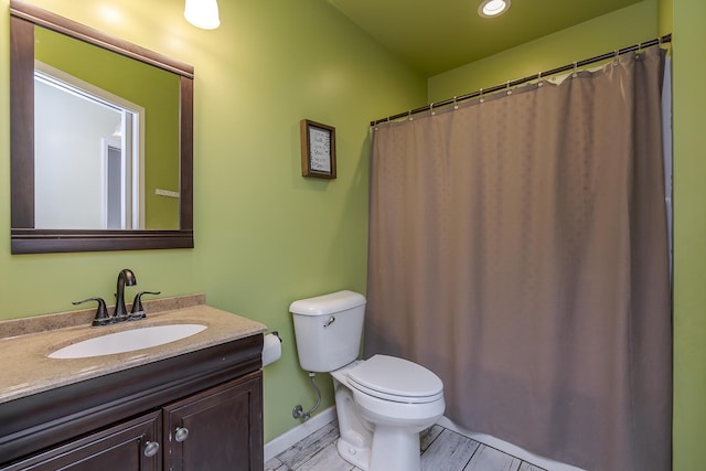 301 Atwood Dr, Lexington, KY 40515 - bathroom with toilet, vanity, baseboards, and recessed lighting