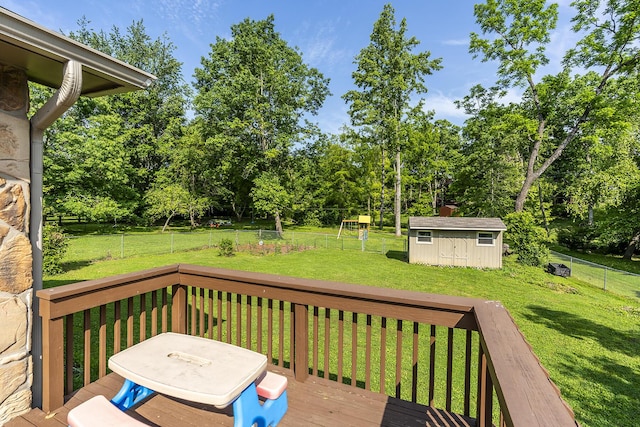 301 Atwood Dr, Lexington, KY 40515 - wooden deck featuring view of wooded area and a playground