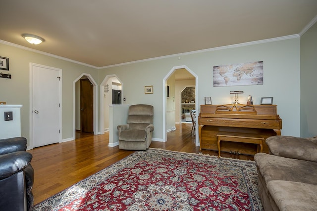 301 Atwood Dr, Lexington, KY 40515 - living room featuring wood finished floors, ornamental molding, arched walkways, and baseboards