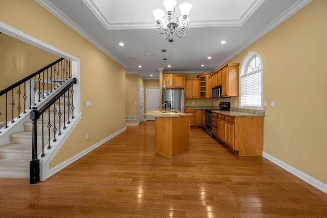 3765 Ridge View Way, Lexington, KY 40509 - kitchen with range with electric stovetop, stainless steel refrigerator with ice dispenser, black microwave, recessed lighting, and light wood-style flooring