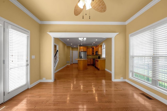 3765 Ridge View Way, Lexington, KY 40509 - kitchen with stainless steel fridge, brown cabinetry, ornamental molding, healthy amount of natural light, and light wood-style floors