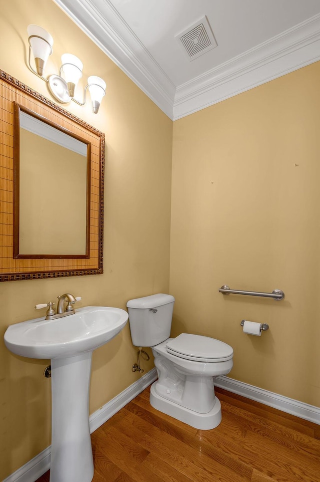 3765 Ridge View Way, Lexington, KY 40509 - half bath featuring ornamental molding, toilet, baseboards, and wood finished floors