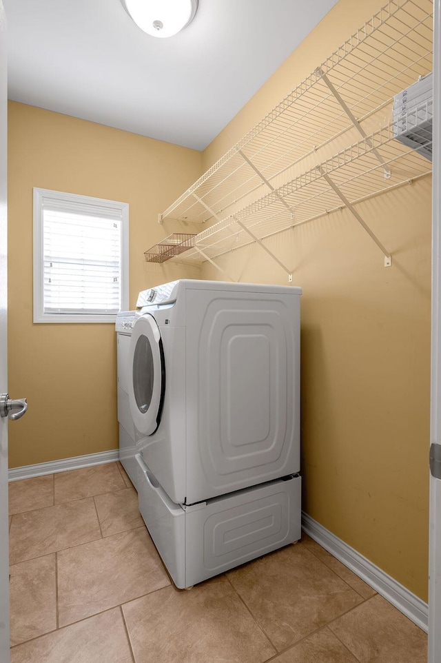 3765 Ridge View Way, Lexington, KY 40509 - laundry room featuring washing machine and clothes dryer, baseboards, and light tile patterned floors