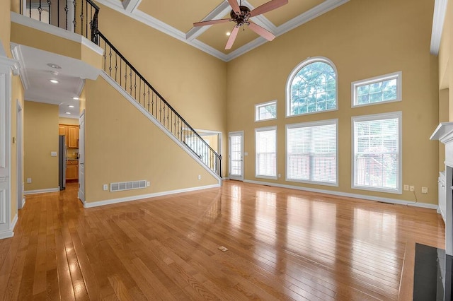 3765 Ridge View Way, Lexington, KY 40509 - unfurnished living room featuring ceiling fan, light wood-style flooring, a high ceiling, a fireplace with flush hearth, and coffered ceiling