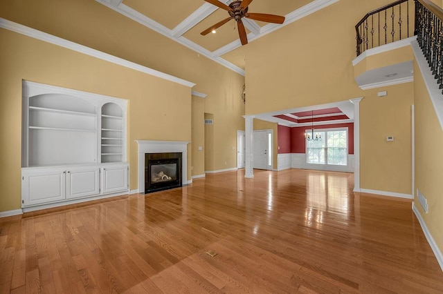 3765 Ridge View Way, Lexington, KY 40509 - unfurnished living room featuring a ceiling fan, a tiled fireplace, light wood-style flooring, a high ceiling, and ornamental molding