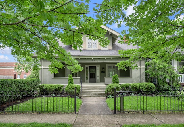109 N Ashland Ave, Lexington, KY 40502 - view of front of home with covered porch, stucco siding, and a shingled roof