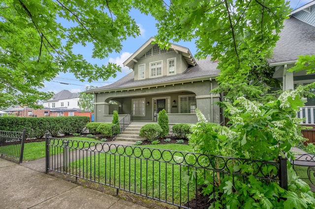 109 N Ashland Ave, Lexington, KY 40502 - bungalow-style home featuring a porch, stucco siding, and a shingled roof