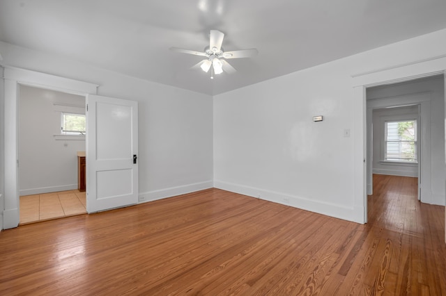 109 N Ashland Ave, Lexington, KY 40502 - spare room with a ceiling fan, light wood-style flooring, and baseboards