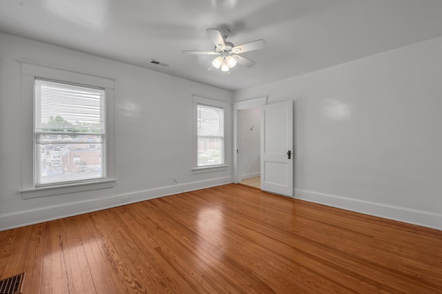 109 N Ashland Ave, Lexington, KY 40502 - unfurnished room featuring baseboards, hardwood / wood-style flooring, and a ceiling fan