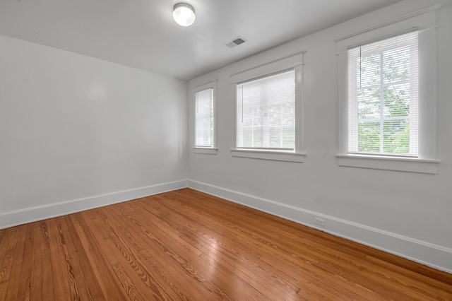 109 N Ashland Ave, Lexington, KY 40502 - spare room featuring baseboards, light wood-type flooring, and healthy amount of natural light