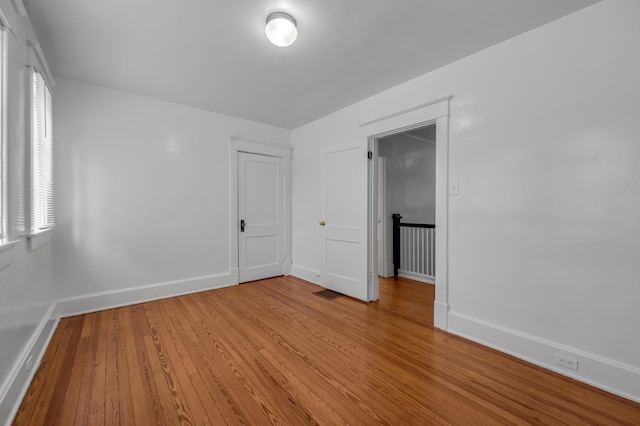 109 N Ashland Ave, Lexington, KY 40502 - unfurnished room featuring light wood-style flooring, baseboards, and healthy amount of natural light