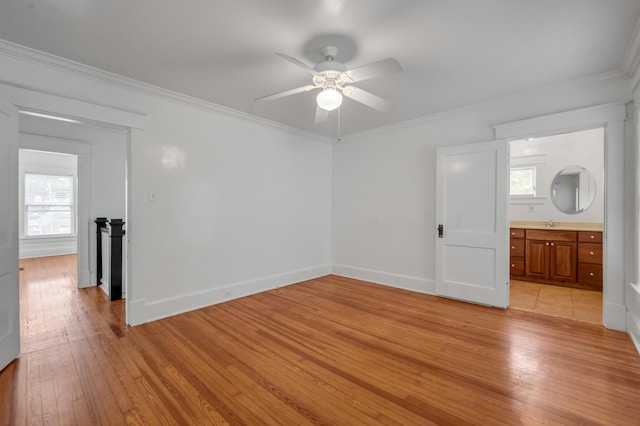 109 N Ashland Ave, Lexington, KY 40502 - spare room with light wood-type flooring, ornamental molding, ceiling fan, plenty of natural light, and baseboards