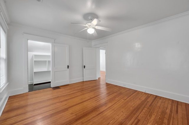 109 N Ashland Ave, Lexington, KY 40502 - unfurnished bedroom with baseboards, light wood-type flooring, crown molding, and multiple windows