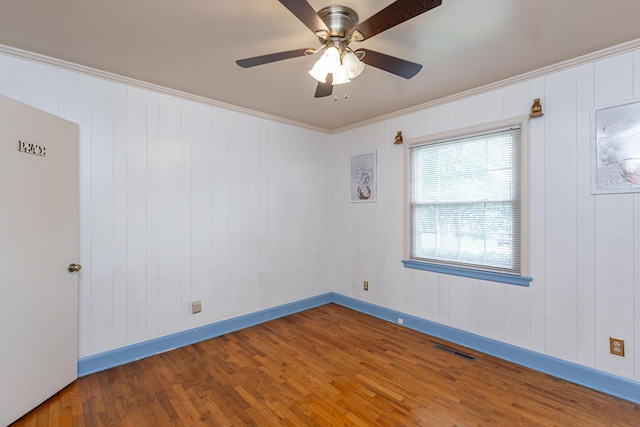 645 Raven Dr, Frankfort, KY 40601 - spare room featuring wood finished floors, a ceiling fan, baseboards, and crown molding
