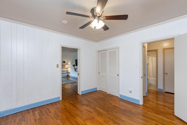645 Raven Dr, Frankfort, KY 40601 - unfurnished bedroom with crown molding, wood finished floors, baseboards, a closet, and ceiling fan
