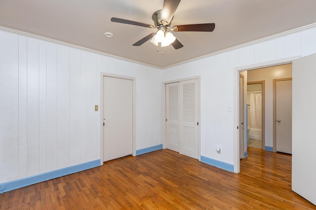 645 Raven Dr, Frankfort, KY 40601 - unfurnished bedroom featuring crown molding, wood finished floors, baseboards, ceiling fan, and a closet