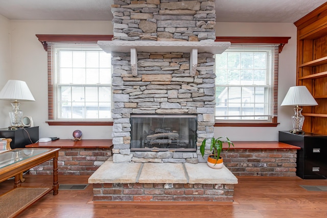 645 Raven Dr, Frankfort, KY 40601 - living area featuring wood finished floors and a stone fireplace