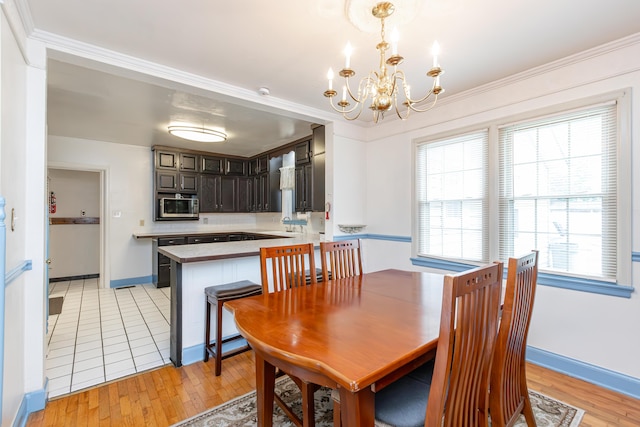 645 Raven Dr, Frankfort, KY 40601 - dining room with a chandelier, light wood-style floors, and plenty of natural light