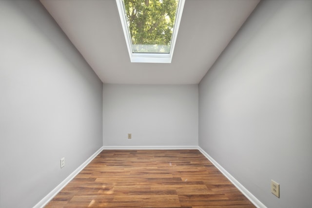 750 Shaker Dr Unit 907, Lexington, KY 40504 - empty room with wood finished floors, baseboards, and a skylight