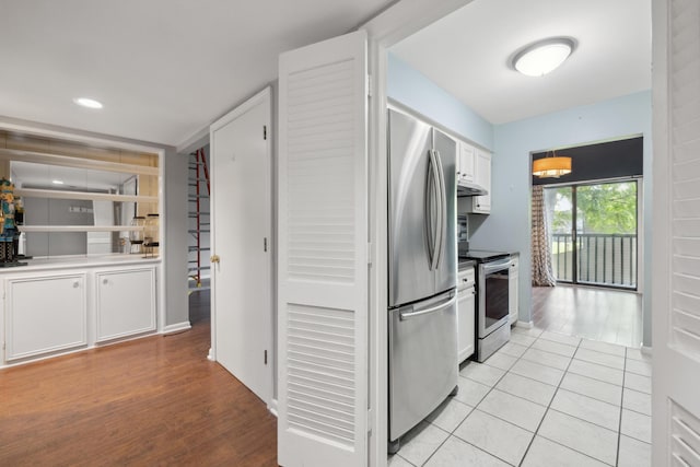 750 Shaker Dr Unit 907, Lexington, KY 40504 - kitchen with stainless steel appliances, white cabinetry, under cabinet range hood, light wood-style flooring, and recessed lighting