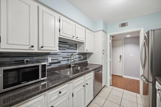750 Shaker Dr Unit 907, Lexington, KY 40504 - kitchen featuring stainless steel appliances, a sink, white cabinetry, and light tile patterned floors