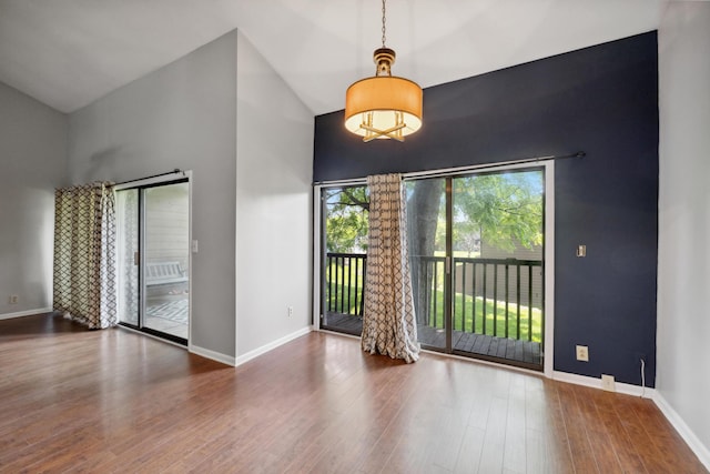 750 Shaker Dr Unit 907, Lexington, KY 40504 - spare room with high vaulted ceiling, baseboards, and wood finished floors