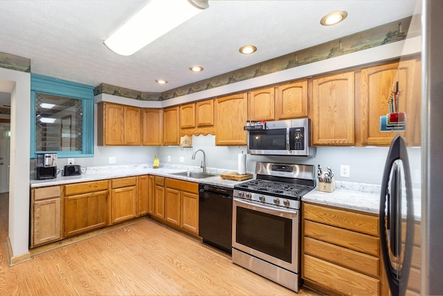 2200 Kays Branch Rd, Owenton, KY 40359 - kitchen with stainless steel appliances, a sink, light wood-type flooring, brown cabinets, and recessed lighting
