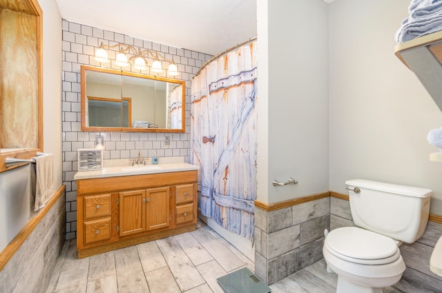 2200 Kays Branch Rd, Owenton, KY 40359 - bathroom with toilet, vanity, tile walls, wood finished floors, and wainscoting