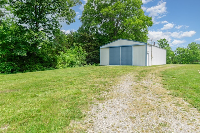 2200 Kays Branch Rd, Owenton, KY 40359 - view of grassy yard featuring a pole building, an outbuilding, driveway, and a garage
