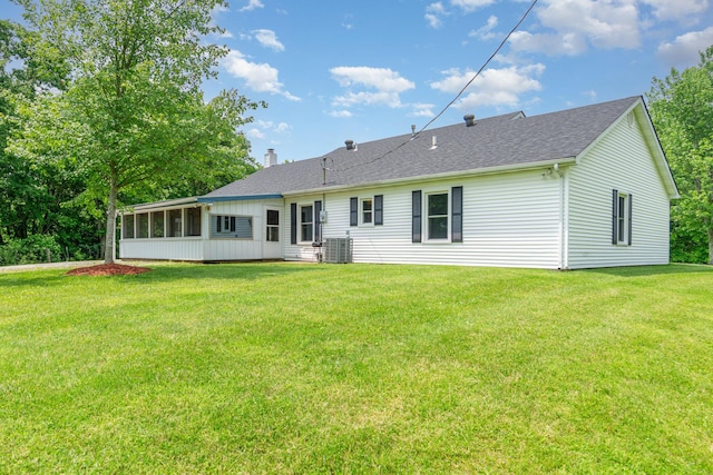 2200 Kays Branch Rd, Owenton, KY 40359 - rear view of property featuring a sunroom, a yard, a chimney, roof with shingles, and cooling unit