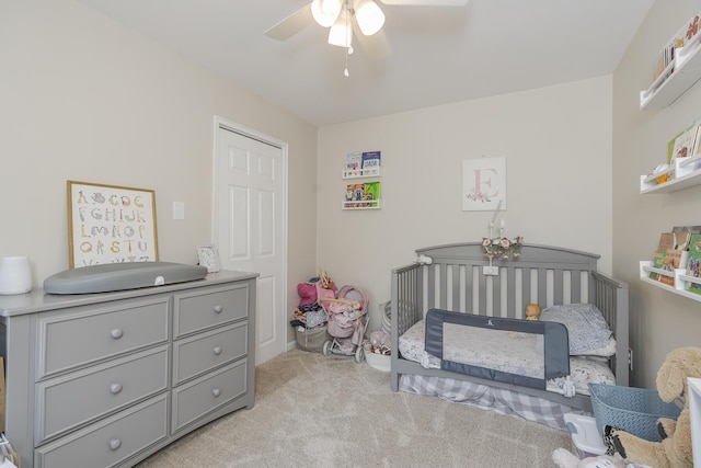 235 W Vista St, Lexington, KY 40503 - bedroom with light colored carpet, a nursery area, and ceiling fan