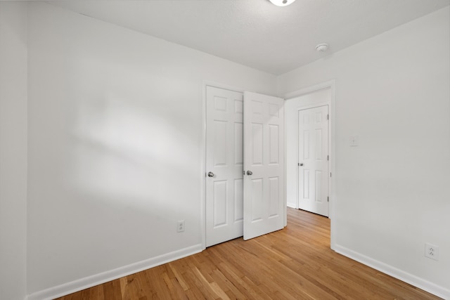 289 Mulberry Ct, Lexington, KY 40509 - unfurnished bedroom with baseboards and light wood-type flooring
