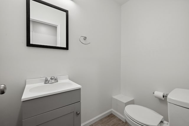 289 Mulberry Ct, Lexington, KY 40509 - bathroom featuring toilet, vanity, baseboards, and wood finished floors