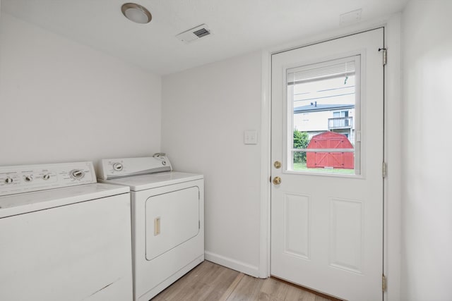 289 Mulberry Ct, Lexington, KY 40509 - laundry area featuring separate washer and dryer, light wood-style flooring, and baseboards
