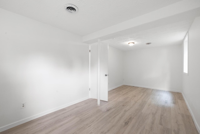 289 Mulberry Ct, Lexington, KY 40509 - spare room featuring light wood finished floors, baseboards, and a textured ceiling