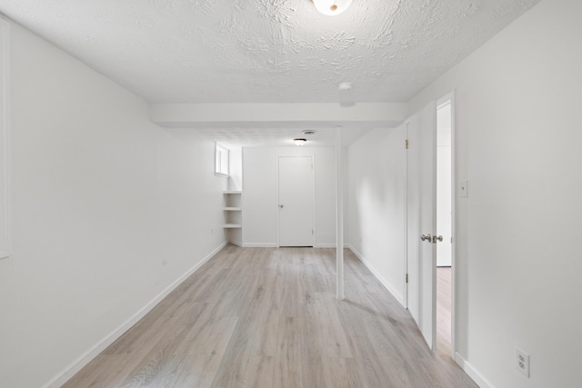 289 Mulberry Ct, Lexington, KY 40509 - unfurnished room featuring light wood finished floors, a textured ceiling, and baseboards