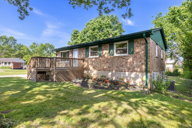 289 Mulberry Ct, Lexington, KY 40509 - rear view of house with a wooden deck, brick siding, and cooling unit
