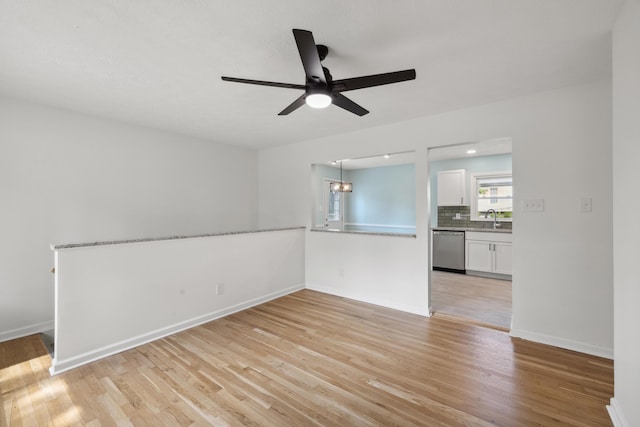 289 Mulberry Ct, Lexington, KY 40509 - empty room with a sink, a ceiling fan, and light wood-style flooring