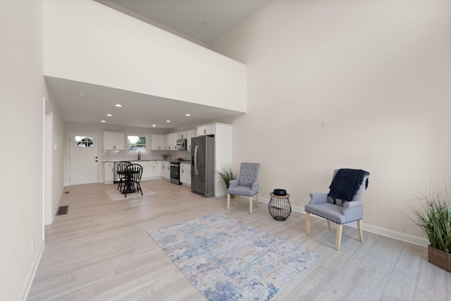 877 Hideaway Dr, Somerset, KY 42503 - living area with light wood-type flooring, baseboards, and recessed lighting