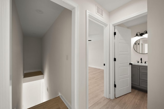 877 Hideaway Dr, Somerset, KY 42503 - hall with a sink, light wood-style floors, and baseboards