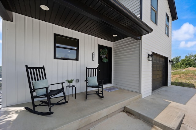 877 Hideaway Dr, Somerset, KY 42503 - property entrance featuring a garage and board and batten siding