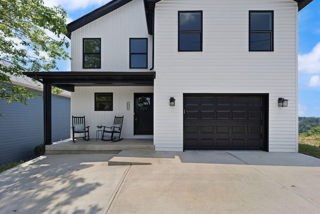 877 Hideaway Dr, Somerset, KY 42503 - view of front of property with covered porch, concrete driveway, and a garage