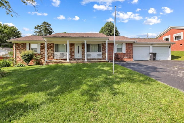 60 Parsons St, Corbin, KY 40701 - ranch-style home with covered porch, an attached garage, driveway, a front lawn, and brick siding