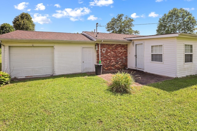 60 Parsons St, Corbin, KY 40701 - view of front of property with brick siding, a garage, a front yard, and a shingled roof