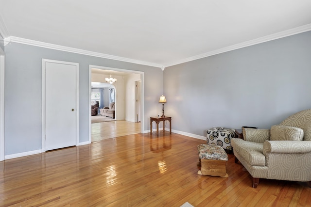 60 Parsons St, Corbin, KY 40701 - living area featuring crown molding, a chandelier, hardwood / wood-style flooring, and baseboards
