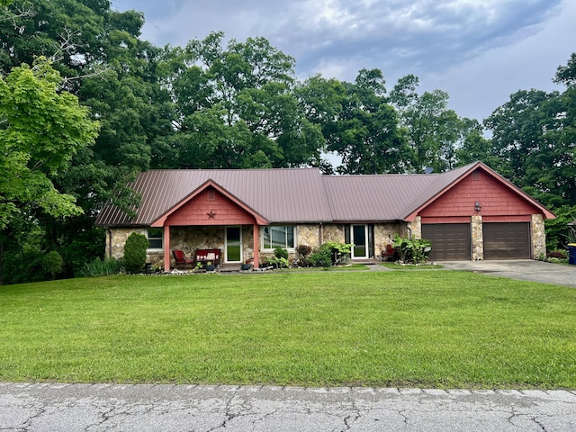 2369 Big Cave Rd, Mount Vernon, KY 40456 - view of front of property featuring stone siding, a front lawn, asphalt driveway, and a garage