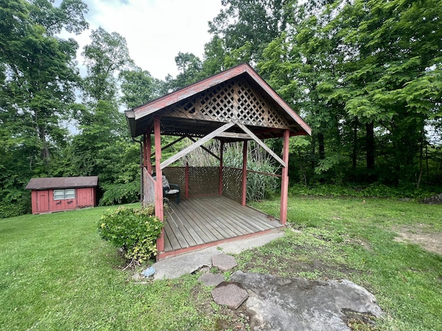 2369 Big Cave Rd, Mount Vernon, KY 40456 - view of green lawn with an outdoor structure, view of wooded area, a deck, and a gazebo