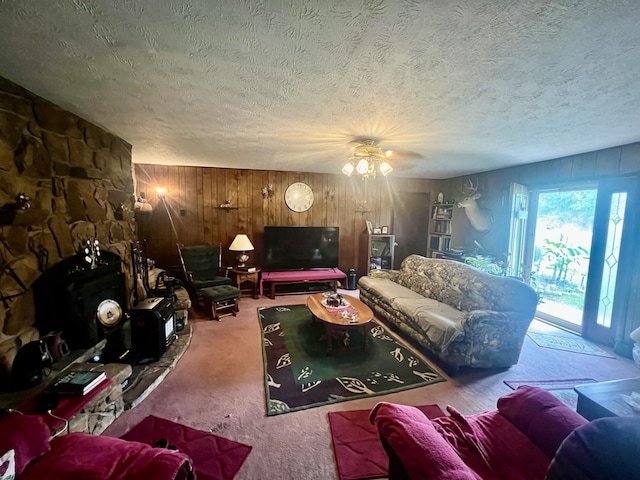 2369 Big Cave Rd, Mount Vernon, KY 40456 - carpeted living area with wood walls, a textured ceiling, and ceiling fan