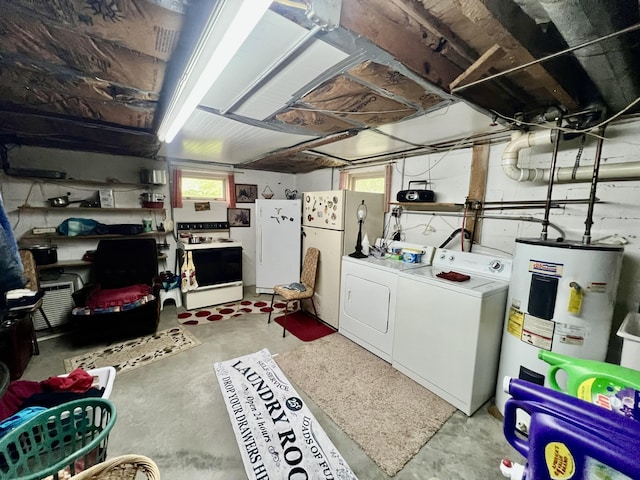 2369 Big Cave Rd, Mount Vernon, KY 40456 - below grade area with washing machine and clothes dryer, water heater, freestanding refrigerator, and healthy amount of natural light